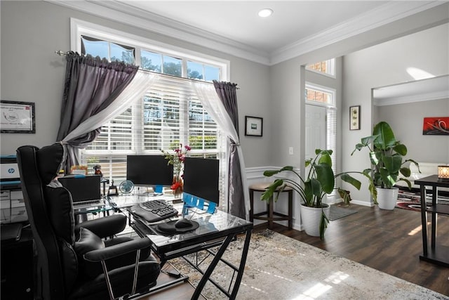 office space with crown molding, wood finished floors, and baseboards