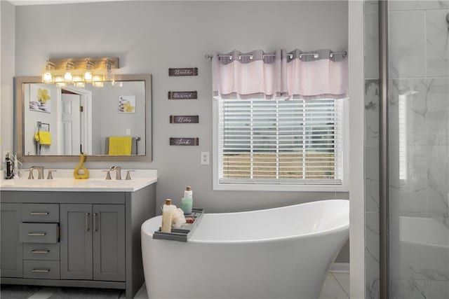 bathroom featuring a sink, a freestanding bath, walk in shower, and double vanity