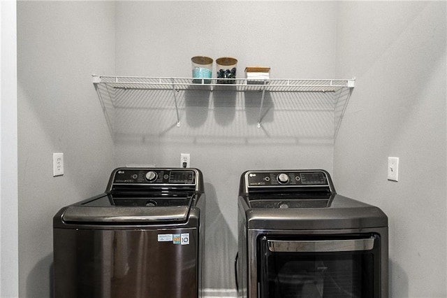 laundry room featuring laundry area and washing machine and clothes dryer