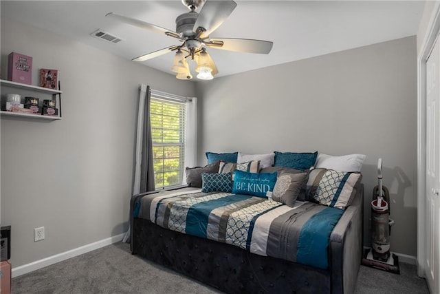 bedroom featuring visible vents, ceiling fan, baseboards, and carpet floors