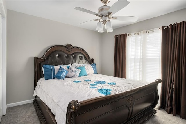 bedroom with baseboards, carpet, and ceiling fan