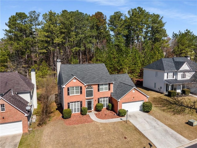 view of front facade with an attached garage and driveway