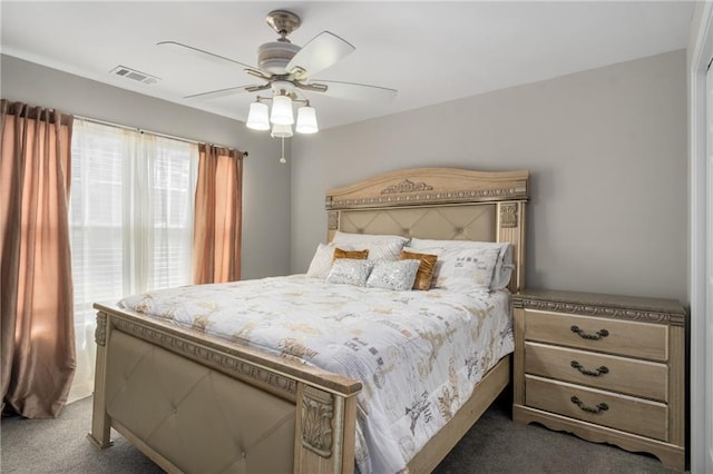 bedroom featuring a ceiling fan, carpet, and visible vents