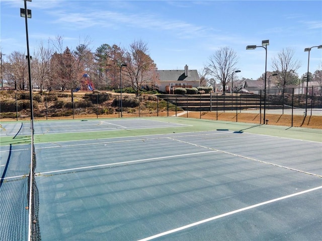 view of sport court with fence