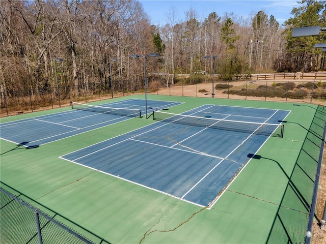 view of sport court featuring community basketball court and fence