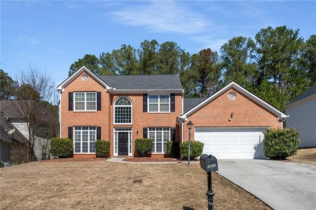 colonial house featuring brick siding, an attached garage, and concrete driveway