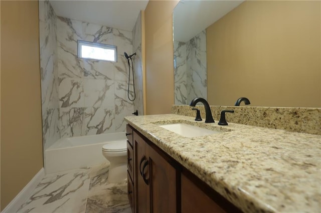 full bathroom with vanity, tiled shower / bath, and toilet