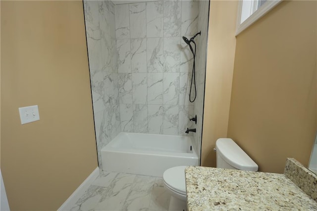 full bathroom with toilet, tiled shower / bath combo, and vanity