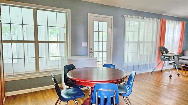 2233 Hansford Pass, Buford, GA 30519 - dining space with wood finished floors and healthy amount of natural light