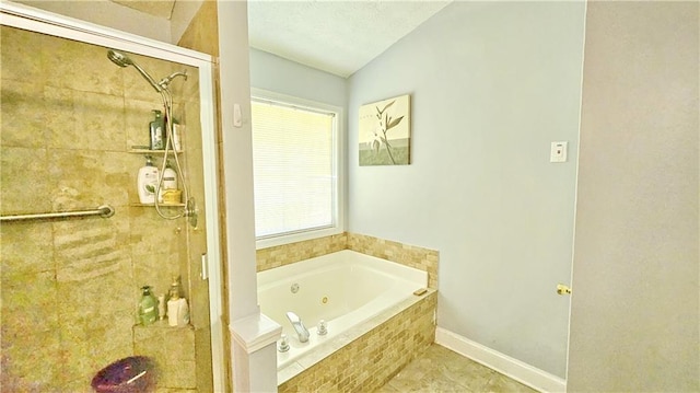 2233 Hansford Pass, Buford, GA 30519 - full bath with a shower stall, a jetted tub, vaulted ceiling, and tile patterned floors
