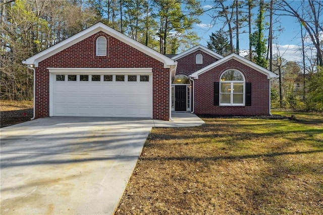 ranch-style house featuring an attached garage, a front yard, concrete driveway, and brick siding