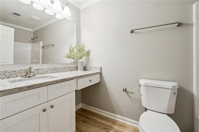 20 Trace Ct, Covington, GA 30016 - bathroom featuring crown molding, baseboards, toilet, wood finished floors, and vanity