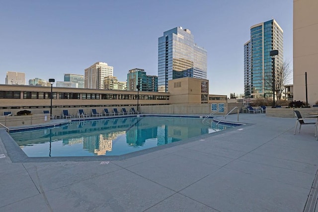 view of swimming pool with a patio