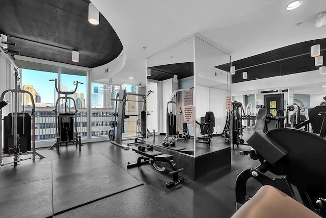 exercise room featuring floor to ceiling windows