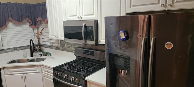 kitchen with white cabinets, sink, and stainless steel appliances