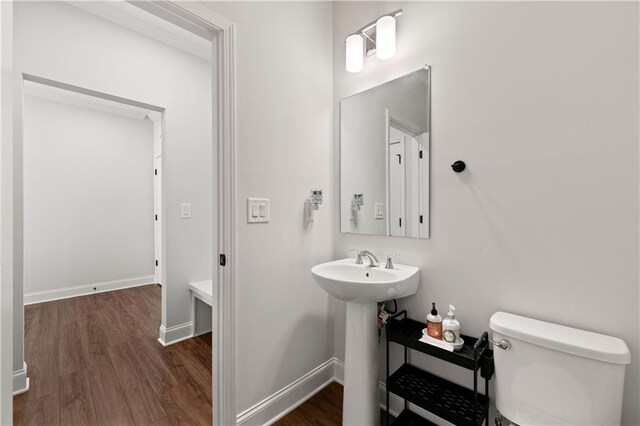 6240 Merrill View Ln, Alpharetta, GA 30004 - bathroom with toilet, sink, and wood-type flooring