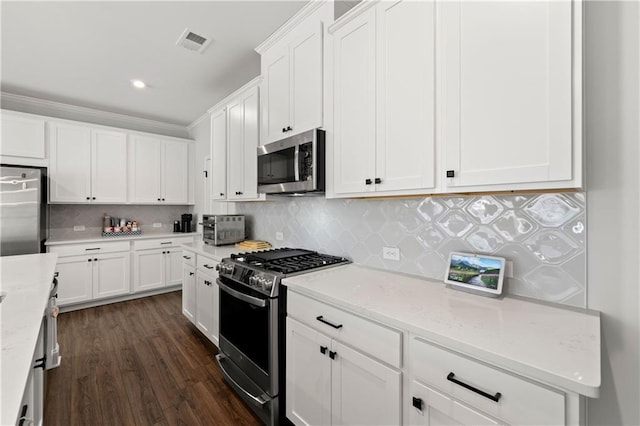 6240 Merrill View Ln, Alpharetta, GA 30004 - kitchen featuring stainless steel appliances, backsplash, light stone counters, white cabinets, and dark hardwood / wood-style floors