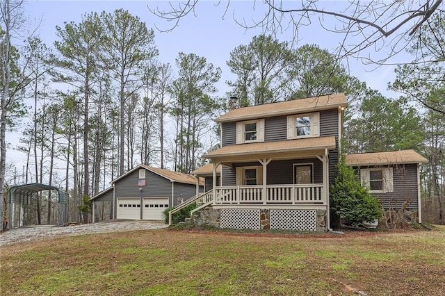 view of front of house featuring a garage, a front yard, a carport, an outbuilding, and a porch