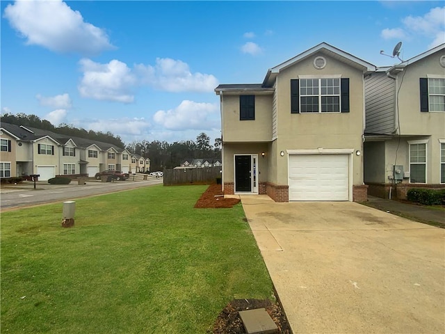 view of front of property with brick siding, stucco siding, a garage, driveway, and a front lawn