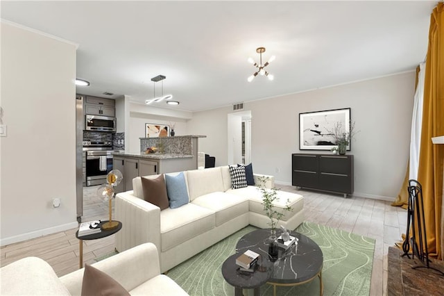 living room featuring light hardwood / wood-style floors and a chandelier