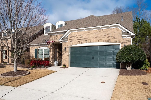 view of front of property with a garage, brick siding, roof with shingles, and concrete driveway