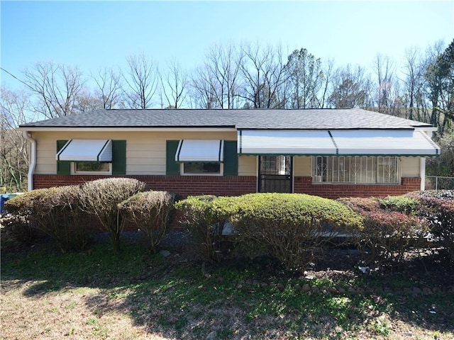 ranch-style house with brick siding