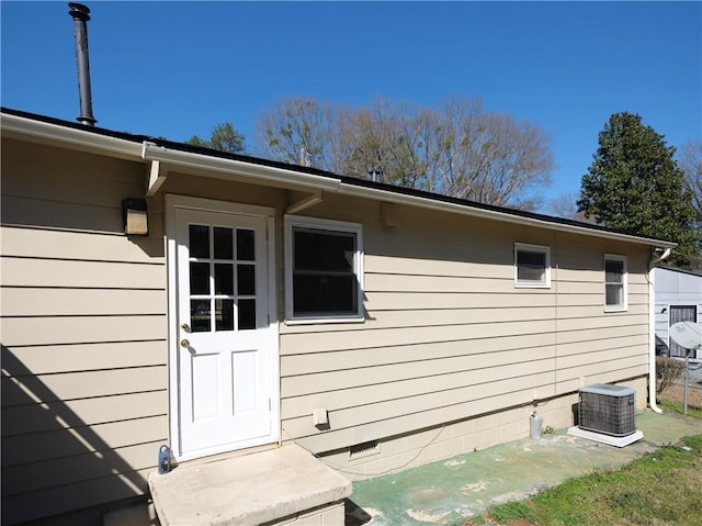exterior space with crawl space and cooling unit