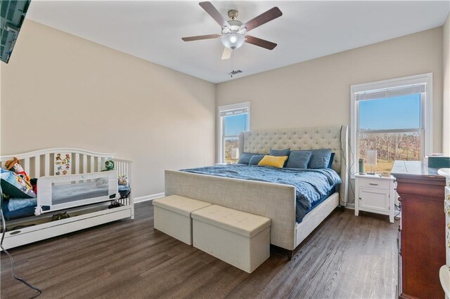 663 Wheeler Rd, Demorest, GA 30535 - bedroom with dark wood-style flooring, baseboards, and a ceiling fan