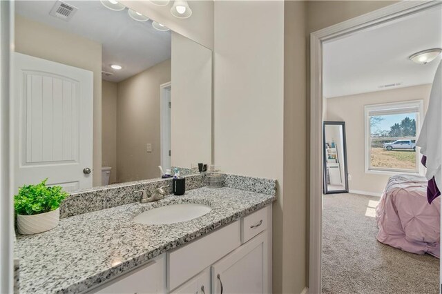 663 Wheeler Rd, Demorest, GA 30535 - bathroom featuring toilet, vanity, baseboards, and visible vents