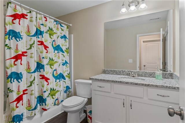 663 Wheeler Rd, Demorest, GA 30535 - full bath with toilet, vanity, shower / bath combination with curtain, and visible vents