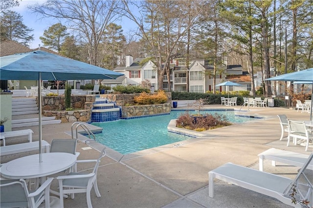 view of pool featuring a patio and pool water feature