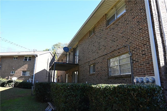 view of side of home with a balcony