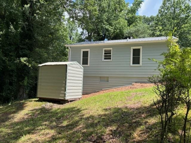 712 Emily St SE, Gainesville, GA 30501 - rear view of property featuring a lawn