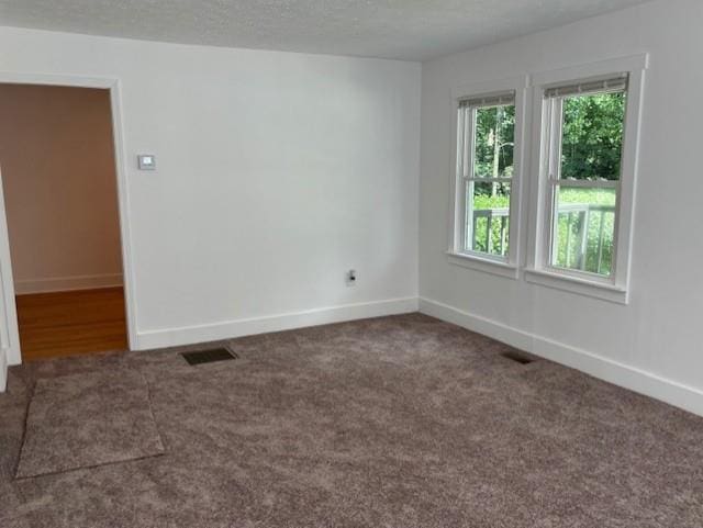 712 Emily St SE, Gainesville, GA 30501 - carpeted empty room featuring baseboards