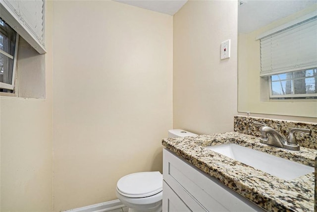 bathroom featuring vanity and toilet