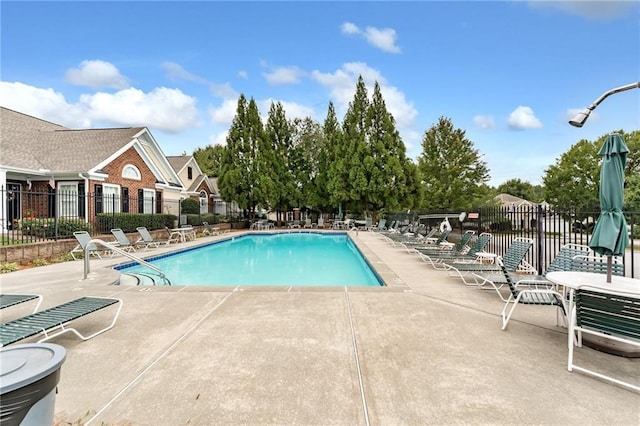 view of swimming pool featuring a patio area