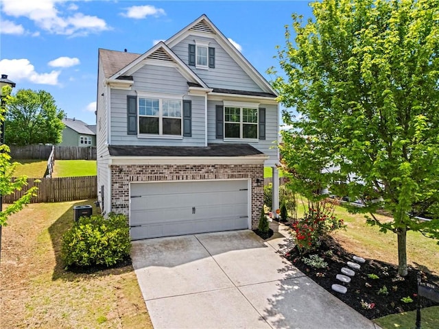 view of front of property with concrete driveway, an attached garage, brick siding, and a front yard