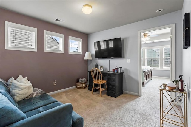 office area featuring carpet floors, visible vents, and baseboards