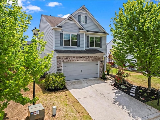 view of front of home with an attached garage, a front lawn, driveway, and brick siding