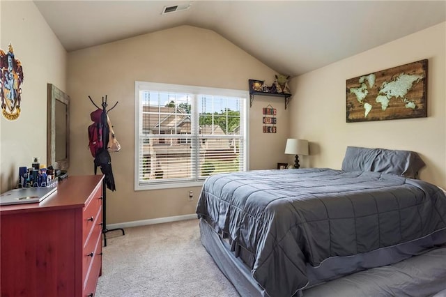 bedroom with light carpet, vaulted ceiling, visible vents, and baseboards