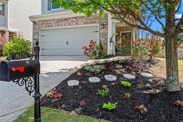 view of home's exterior with concrete driveway, an attached garage, and brick siding