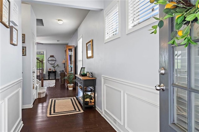 entryway with wood finished floors