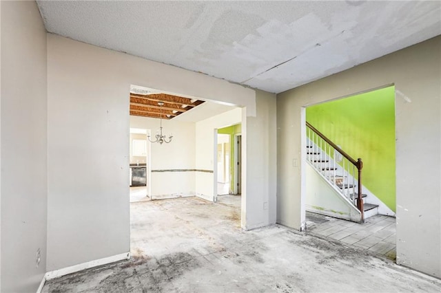 empty room with concrete flooring