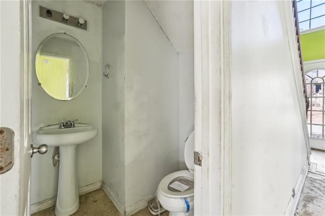 bathroom with sink and toilet