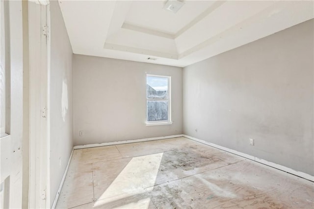 empty room with a tray ceiling