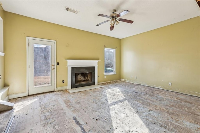 unfurnished living room with ceiling fan