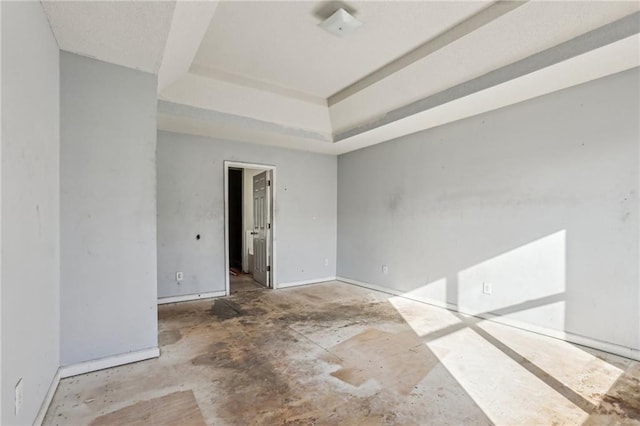 empty room with a raised ceiling