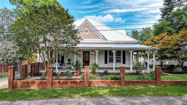 country-style home featuring a porch