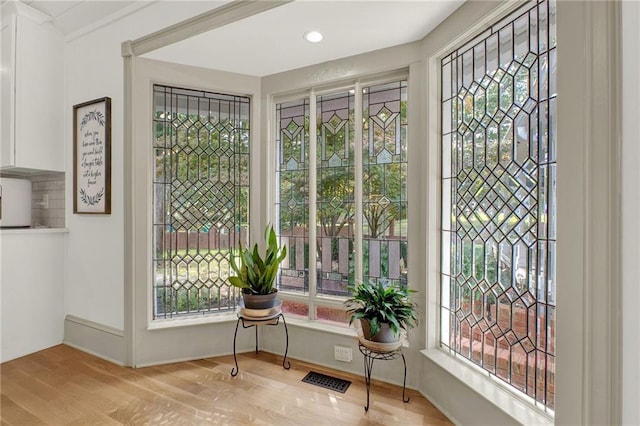 entryway featuring a healthy amount of sunlight and light hardwood / wood-style flooring