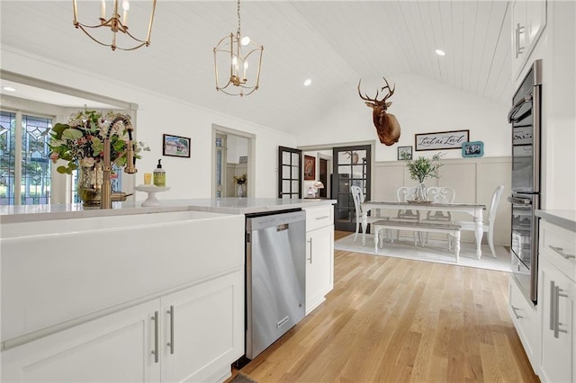 kitchen featuring light hardwood / wood-style flooring, white cabinetry, dishwasher, wooden ceiling, and vaulted ceiling